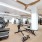 fitness center with large open spaces allowing room for workouts and for using equipment
