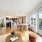Open living room with floor to ceiling windows